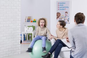 Mother and her child with ADHD during therapy