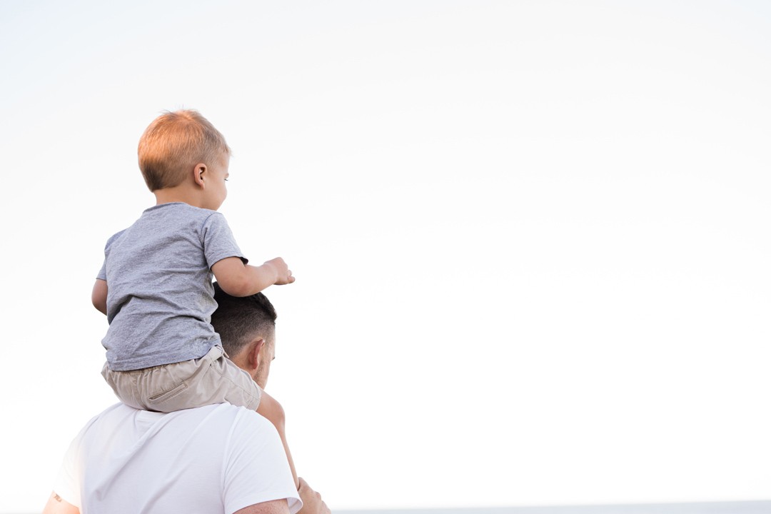 dad-carrying-his-son-by-kelli-mcclintock-unsplash