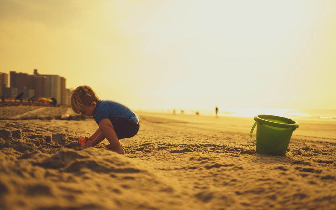 kid-building-sand-castle-on-the-beach-by-jeremy-mcknight-at-unsplash