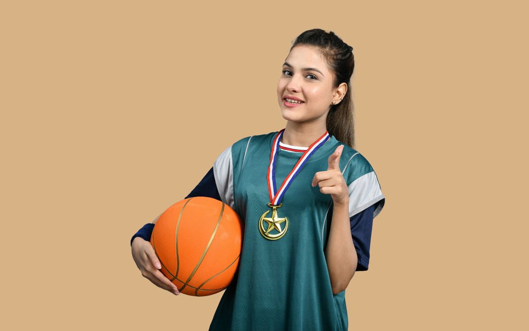 a-woman-holding-basketball-by-fotos-at-unsplash