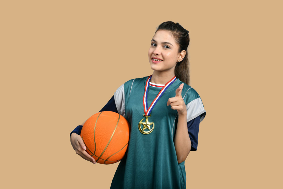 a-woman-holding-basketball-by-fotos-at-unsplash