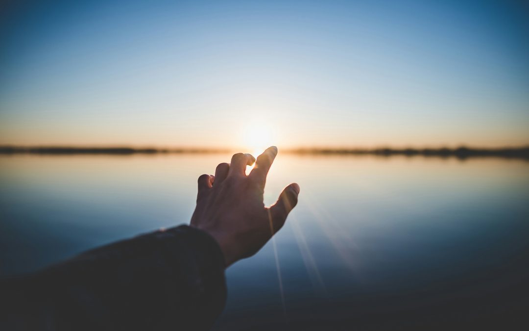 person-and-reaching-out-towards-sun-by-marc-olivier-jodoin-at-unsplash