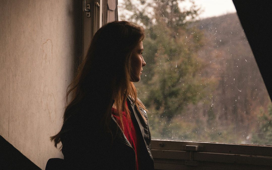 woman-standing-in-front-of-window-looking-out-by-benjamin-voros-at-unsplash