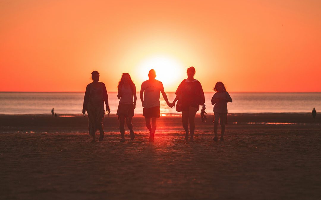 family-at-the-beach-sunset-by-kevin-delvecchio-unsplash