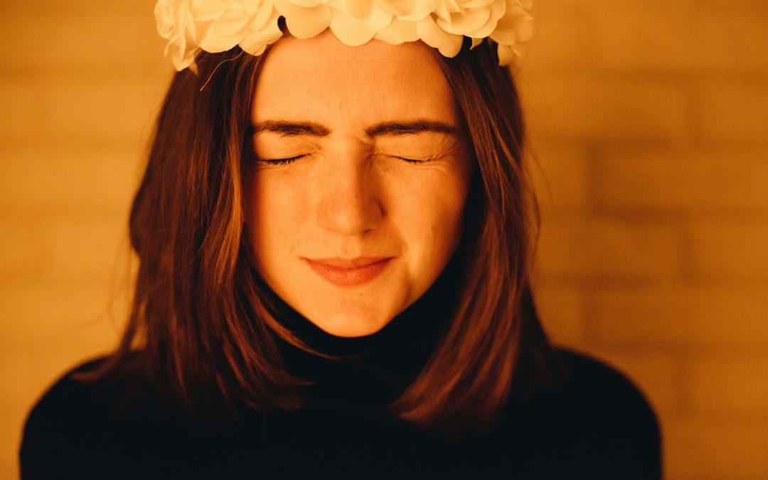 woman-both-closed-eyes-with-white-flower-headress-by-dmitriy-frantsev-at-unsplash