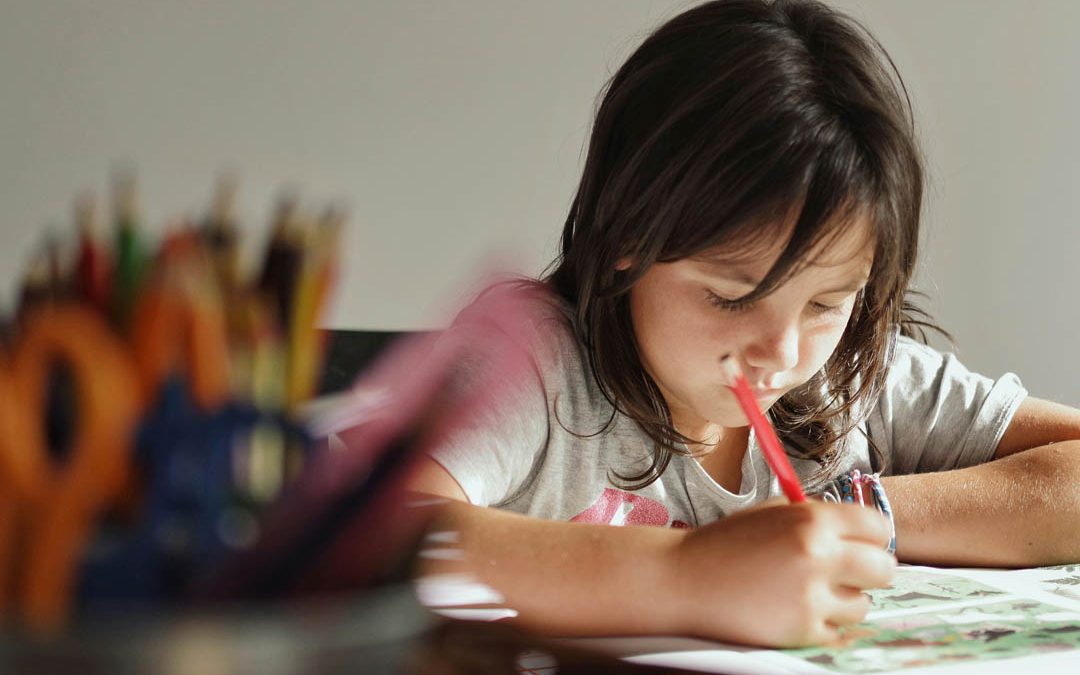 child-answering-assignments-xavi-cabrera-unsplash
