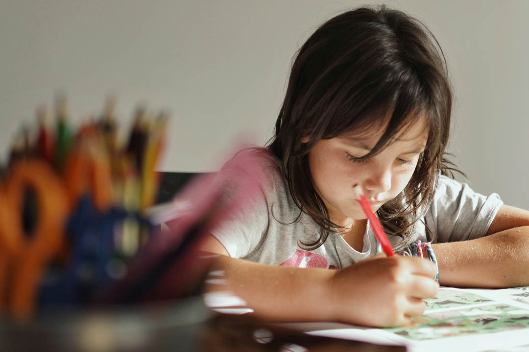 child-answering-assignments-xavi-cabrera-unsplash