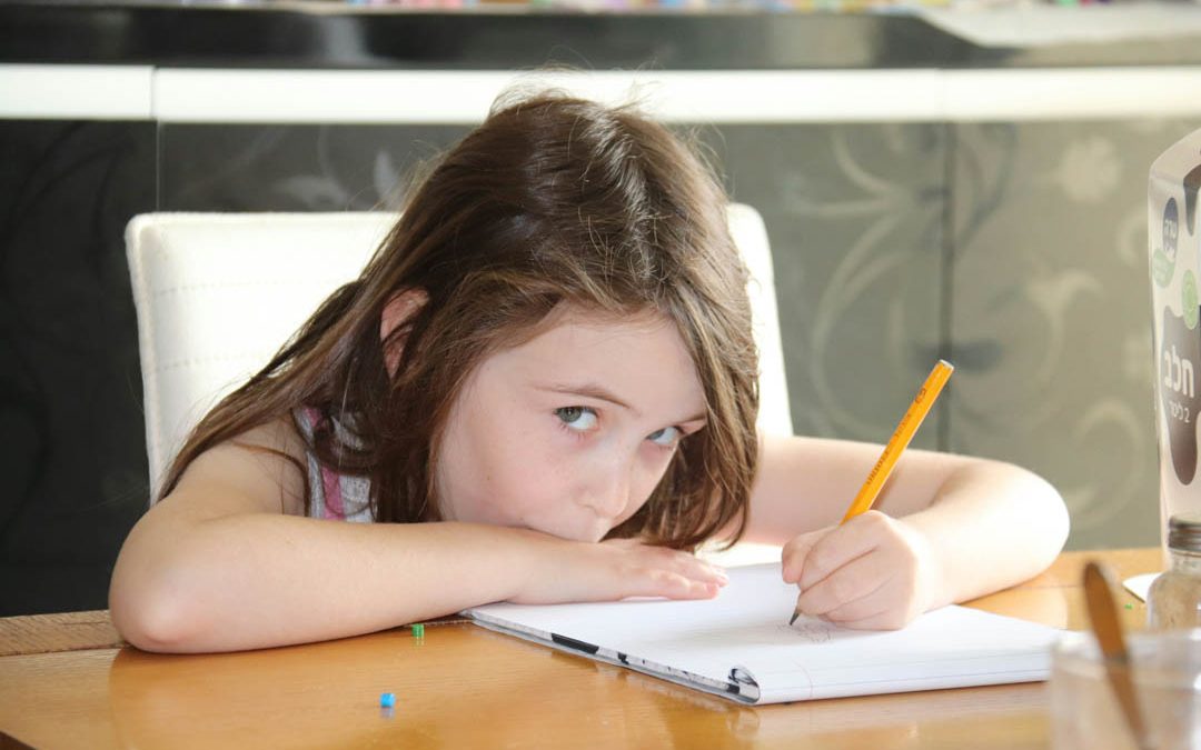 little-girl-answering-her-homework-shalev-cohen-unsplash
