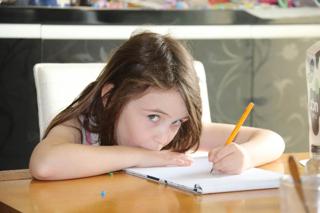 little-girl-answering-her-homework-shalev-cohen-unsplash